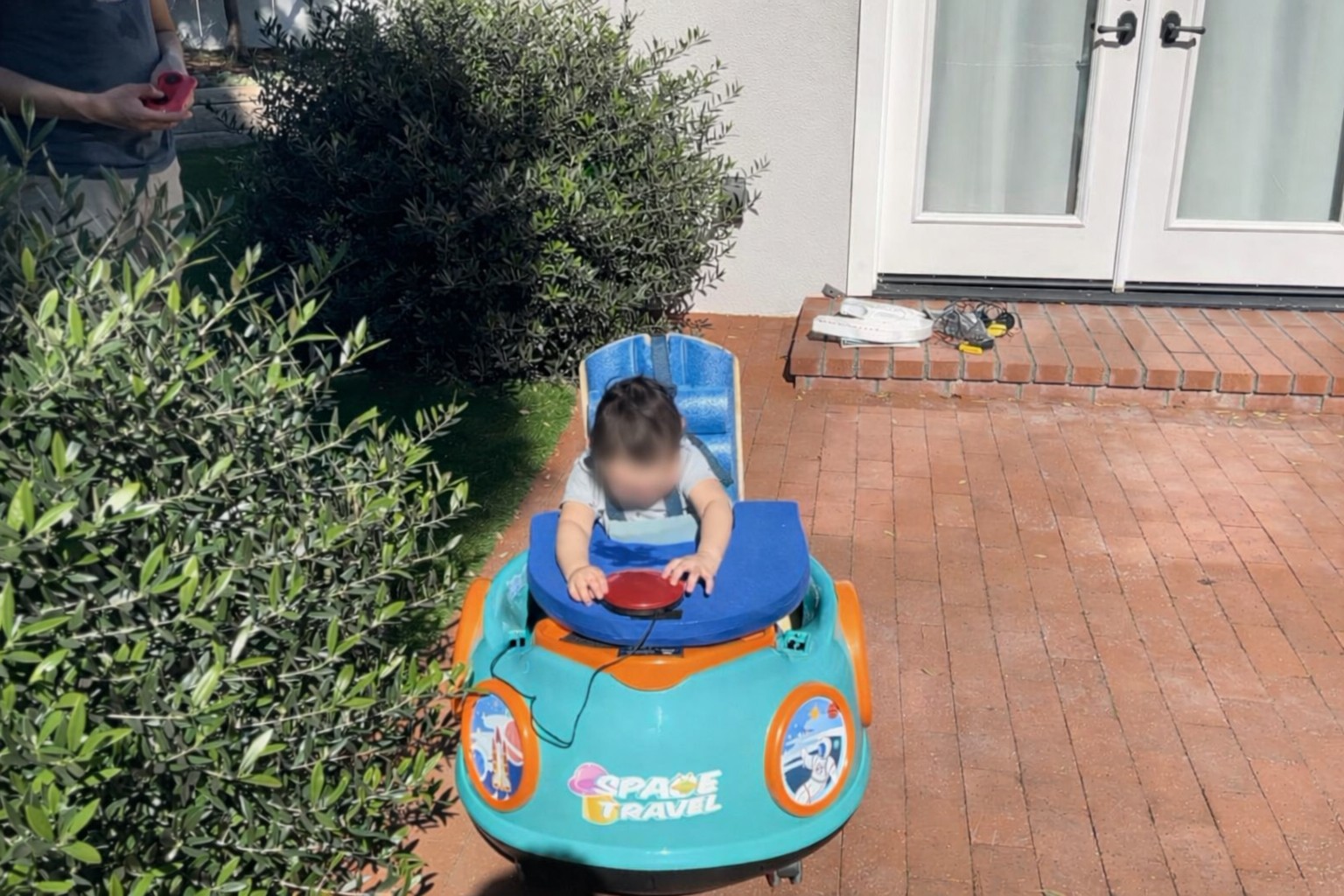 Power chair for toddler with cerebral palsy, showing customized design and components.