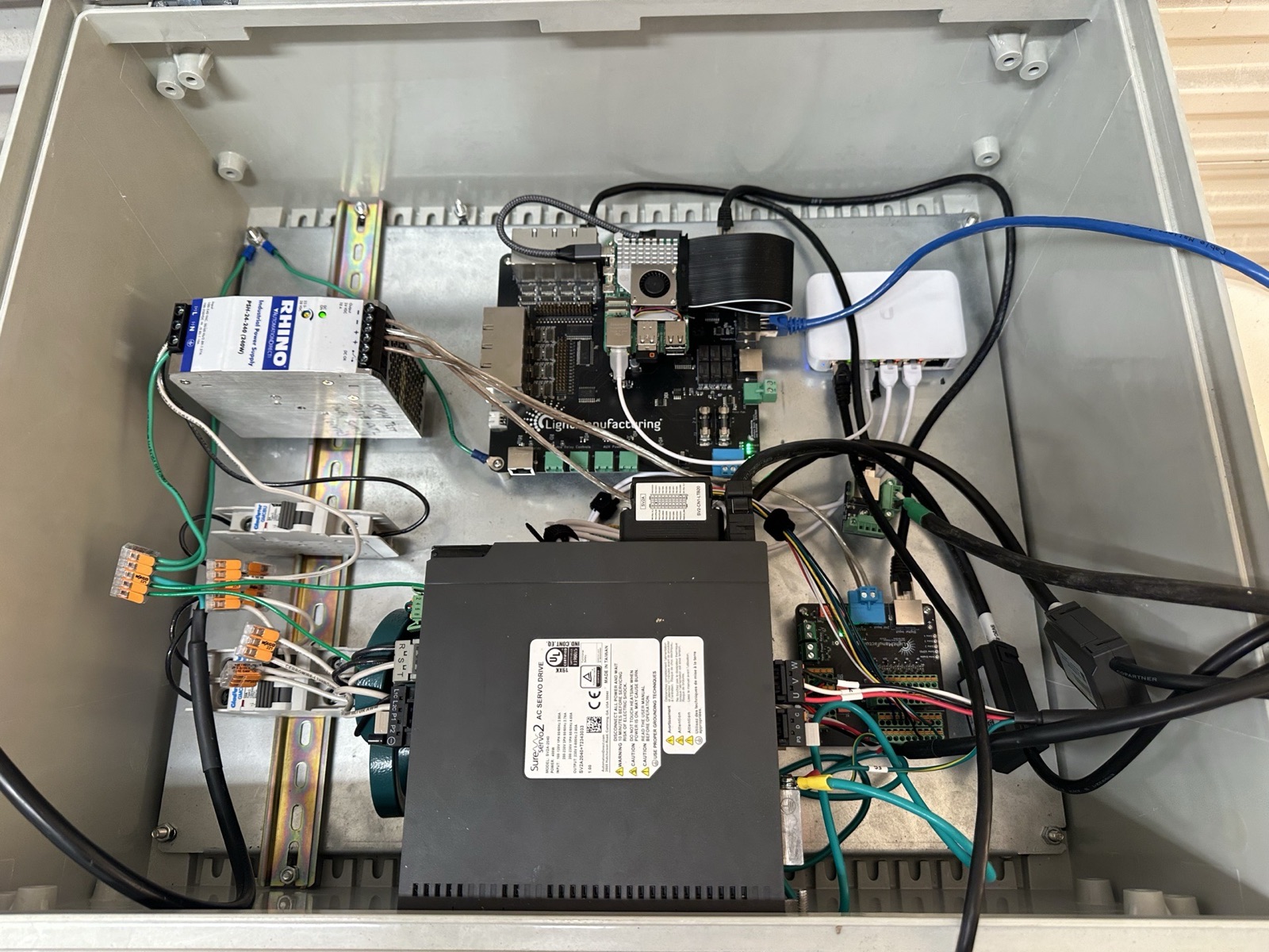 Servo control project hardware with wiring, electronics, and actuator components visible in frame.